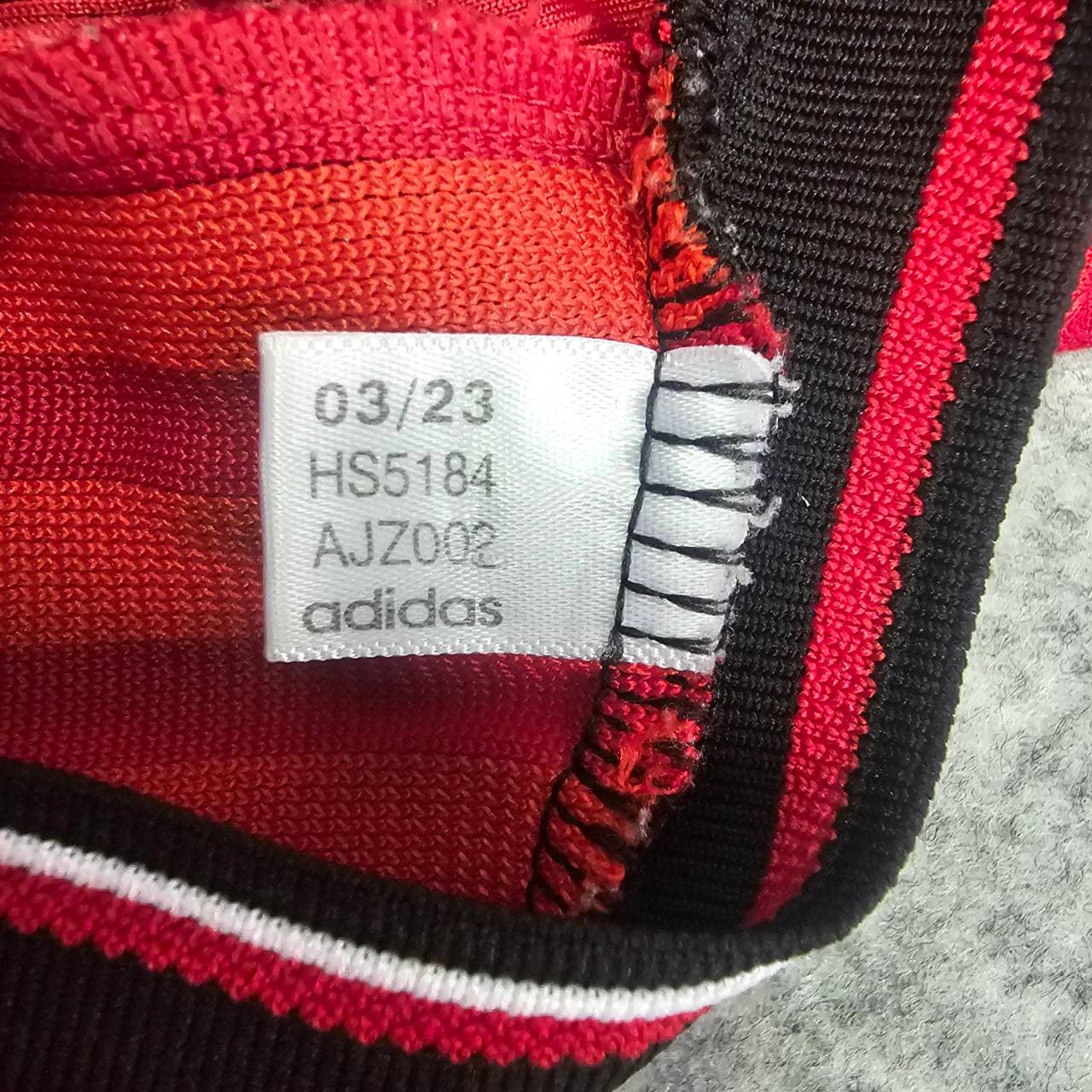Not genuine Adidas FI5295 code tag and overlock stitching