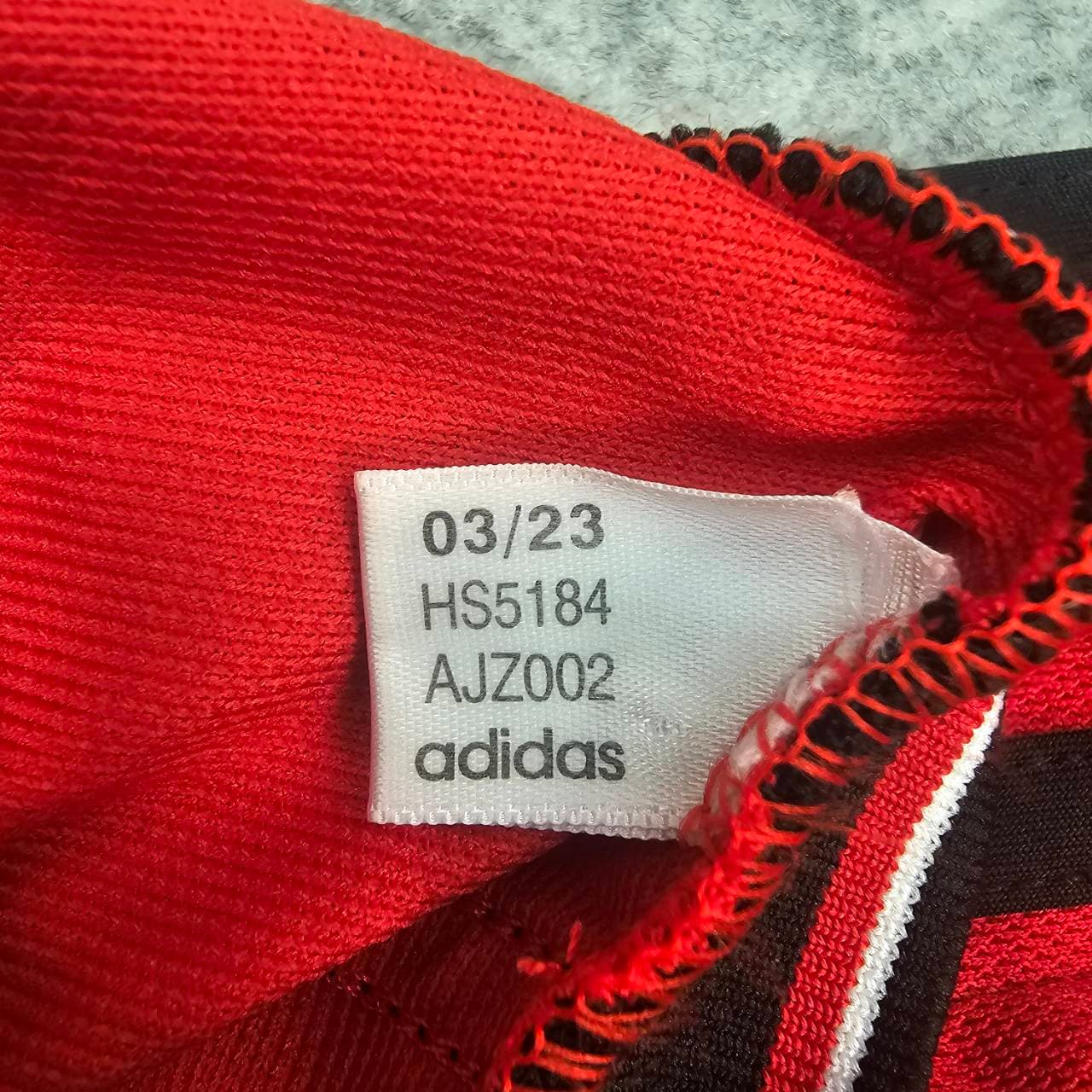 Not genuine Manchester United shirt carrying copied Adidas code HS5184