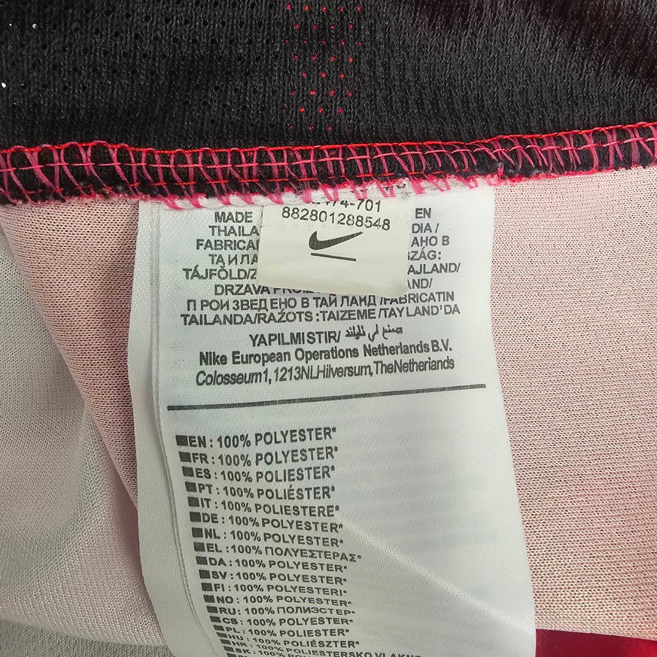 Not genuine Nike wash label with partly covered product code label