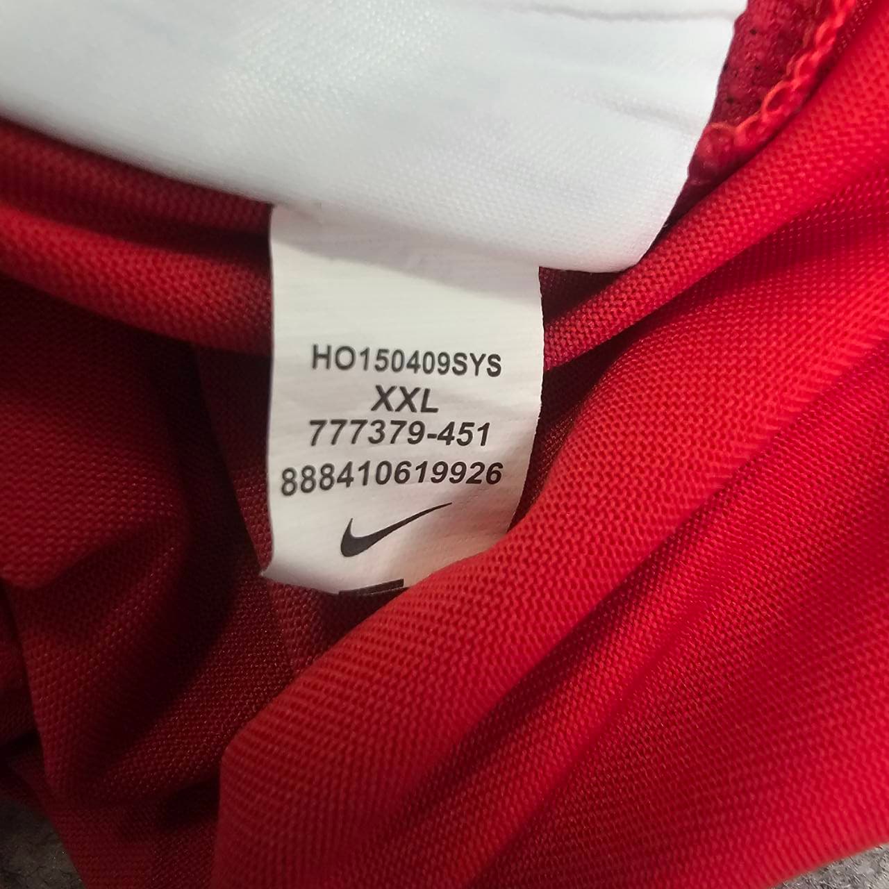 Not genuine Nike product code label showing HQ150409SYS and 777379-451